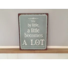 Metalskilt med teksten "little by little.."