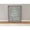 Metalskilt med teksten "little by little.."